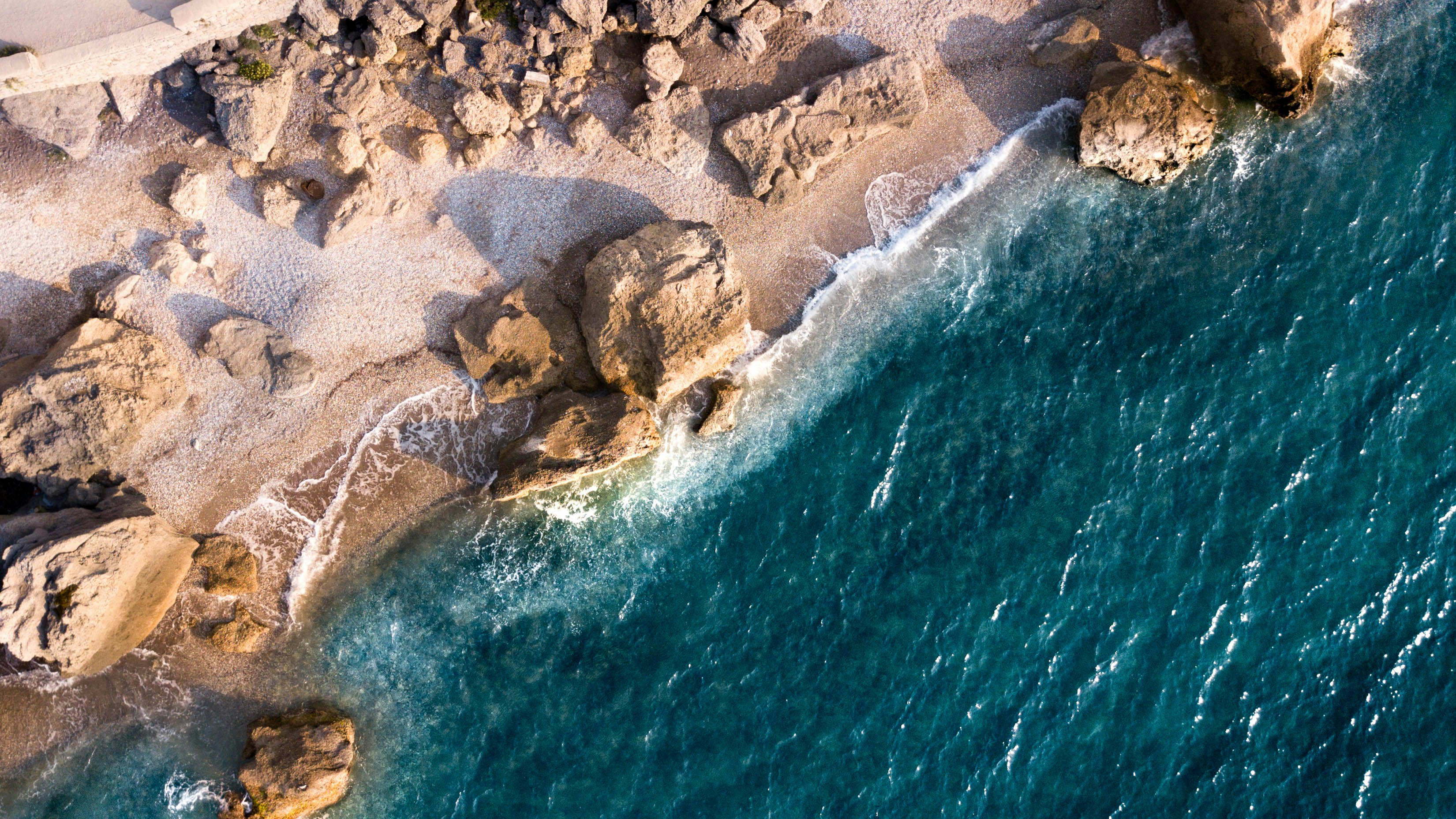 rock formation on shore during day